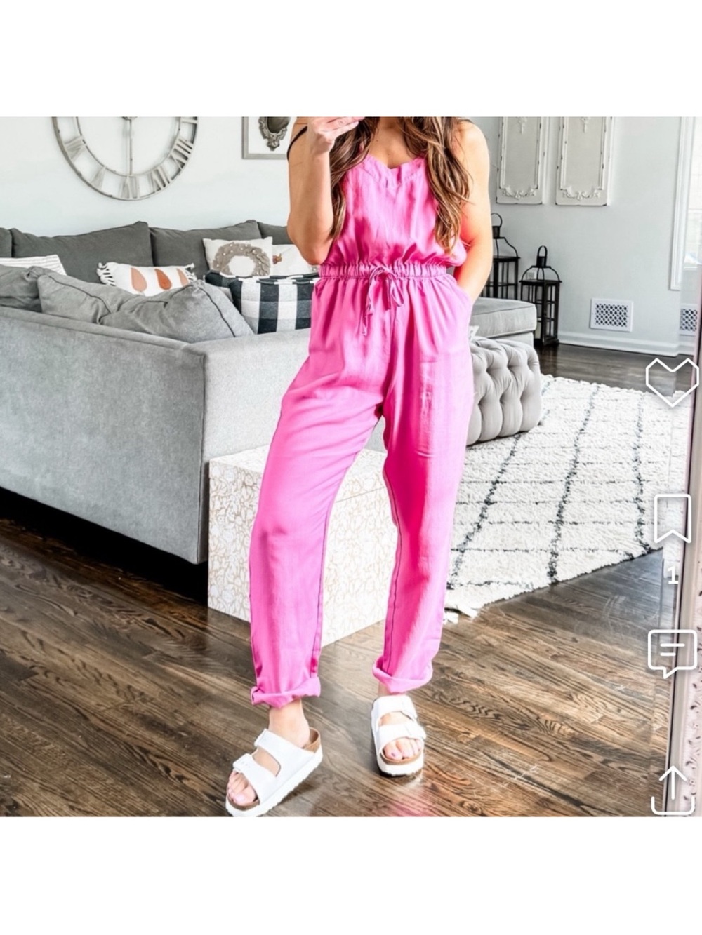 Soft flowy pink lightweight sleeveless jumpsuit cinched tie waist with pockets.